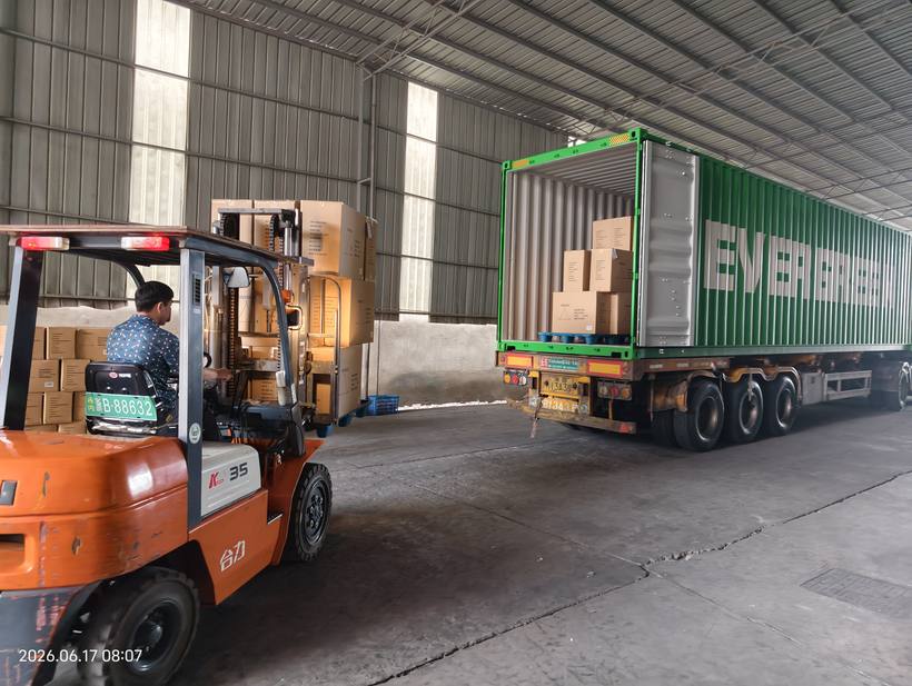 Forklift loading Evergreen container with paper product cartons — June 17 2026 08:07